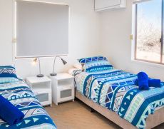 Mackerel-Islands-accommodation-beachfront-cabin-bedroom-6-slider-1.jpg